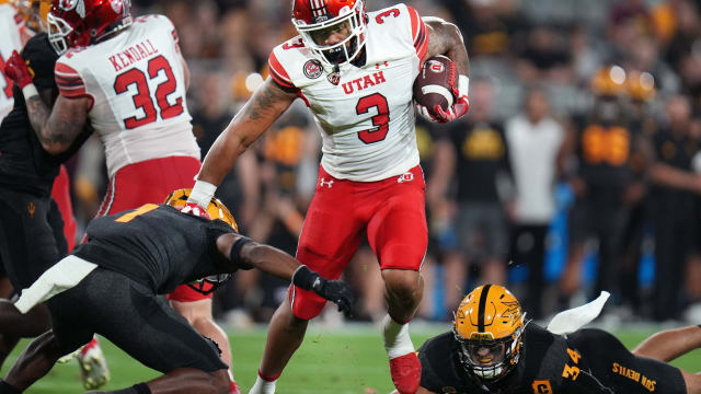 Utah's Ja'Quinden Jackson (3) runs the ball as ASU defenders Jordan Clark (1) and Kyle Soelle (34) dive for the tackle at Sun Devil Stadium on Saturday, Sept. 24, 2022.